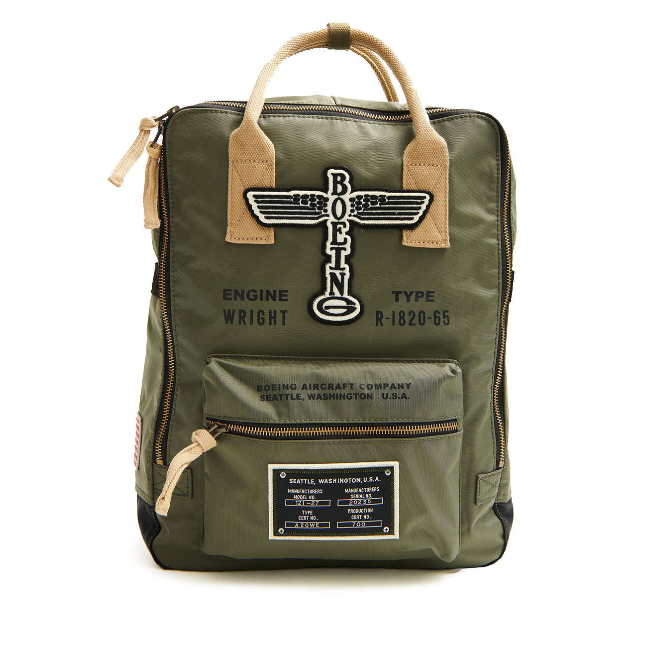 Explore The Boeing Stores Red Canoe Backpack in green, showcasing a vintage Boeing logo, embroidered text, beige handles, front zip pocket, ENGINE WRIGHT patch, and other aviation-themed details that embody the 20th-century aircraft spirit.