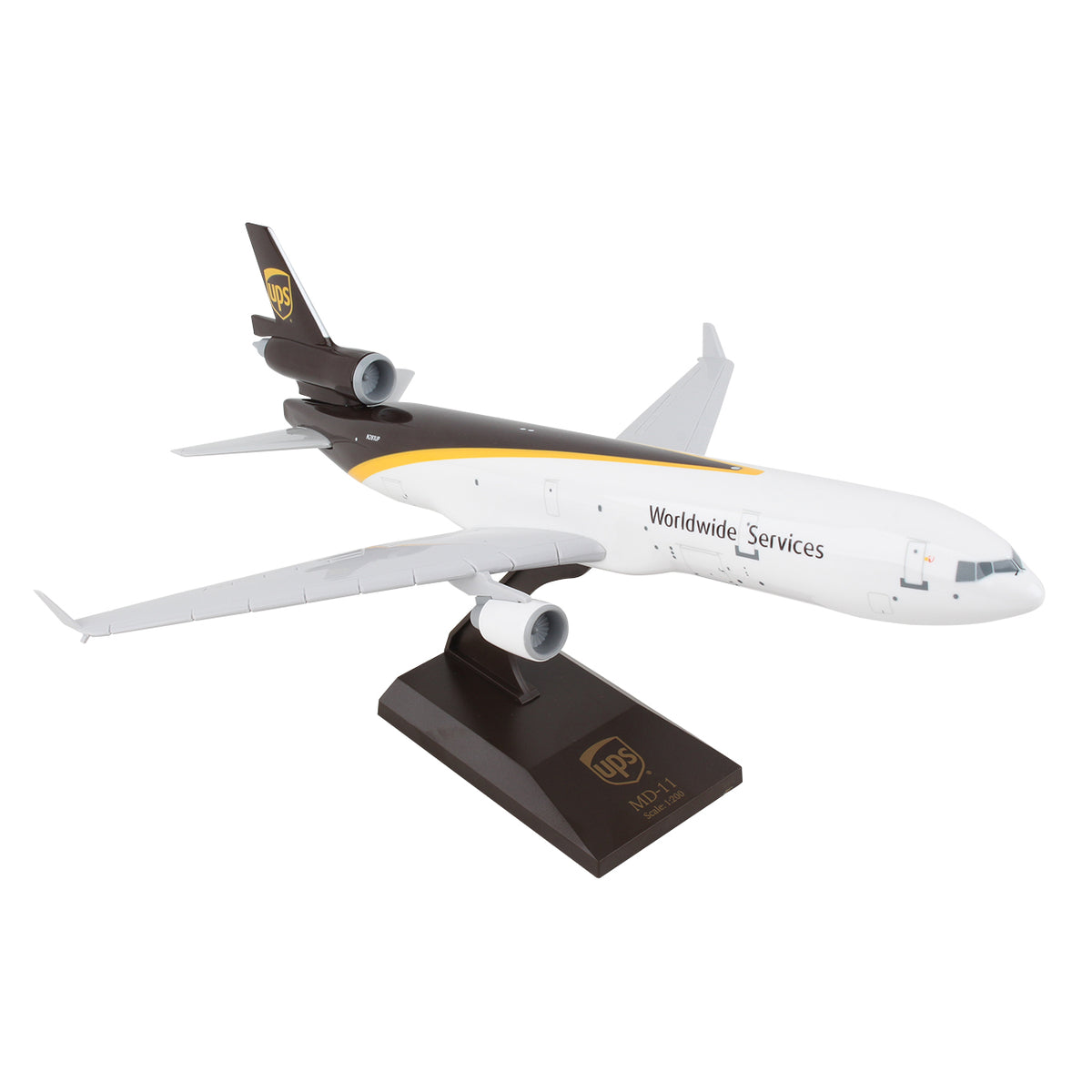 The Daron UPS Boeing MD-11 1:200 Model features UPS branding and Worldwide Services text, a snap-fit design, white body with brown and gold accents, and comes on a black display stand, ideal for collectors.
