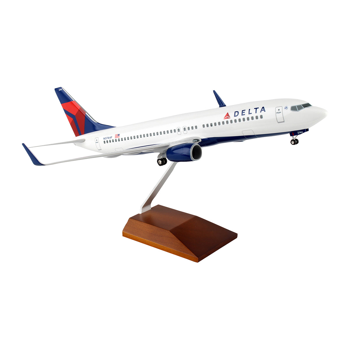 The Daron Delta Air Lines Boeing 737-800 1:100 Model comes with a wooden stand, ideal for collectors, and features the airlines livery on a white background.