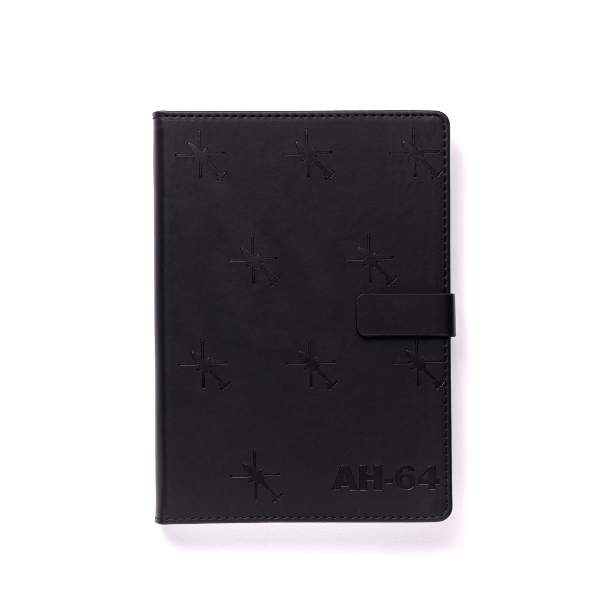 The Boeing Store’s Boeing AH-64 Apache Notebook is a black leather notebook embossed with star-like symbols and AH-64 in the corner, inspired by Boeing aircraft and featuring a magnetic strap closure.