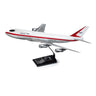 The Boeing Store presents the Boeing 747 Rollout Livery 1:144 Model, showcasing the legendary airplane in red and white on a black stand, with detailed profiles of its wings and engines.
