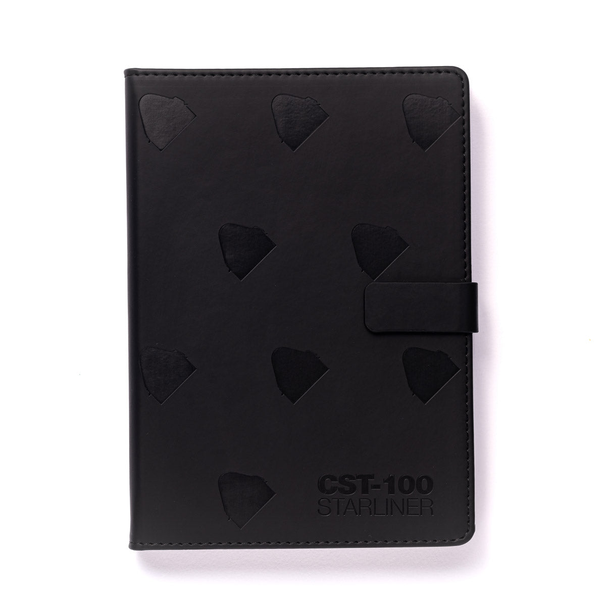 The Boeing CST-100 Starliner Notebook by The Boeing Store is a black PU hardcover with embossed triangular patterns, a right-side clasp, and the text CST-100 STARLINER elegantly embossed in the bottom right corner, all on a sleek plain white background.