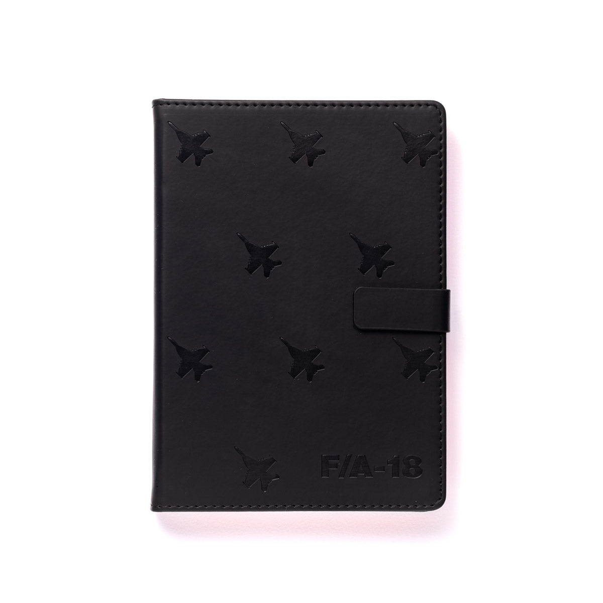 The Boeing Stores F/A-18 Super Hornet Notebook showcases a sleek PU hardcover with jet silhouettes and text design, featuring a magnetic flap closure on a pristine white background.