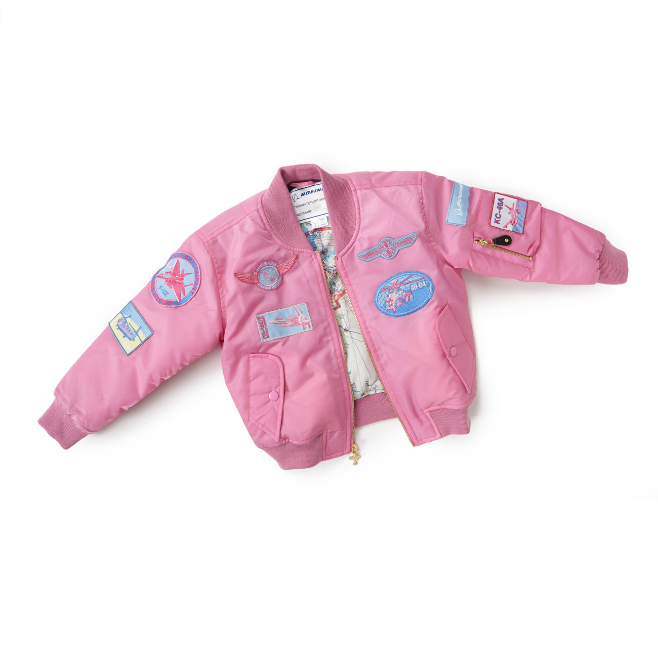 The Boeing Store offers the Boeing Kids Pink Aviator Jacket, a nylon flight jacket with ribbed cuffs and hem. It features a front zipper, patterned lining, and blue-red plane and star patches that highlight its aeronautical appeal—perfect for aviation enthusiasts.