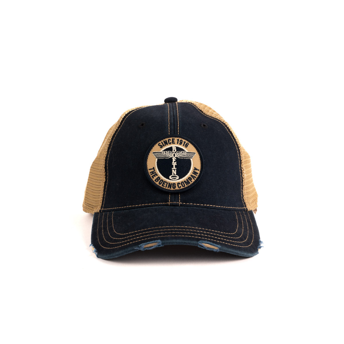 The Boeing Store presents the Boeing Airplane Logo Washed Twill Trucker Hat: a black and tan cap with a vintage look, featuring a front Since 1916, The Boeing Company logo. It has a distressed brim, tan mesh back, and snapback closure for an adjustable fit.