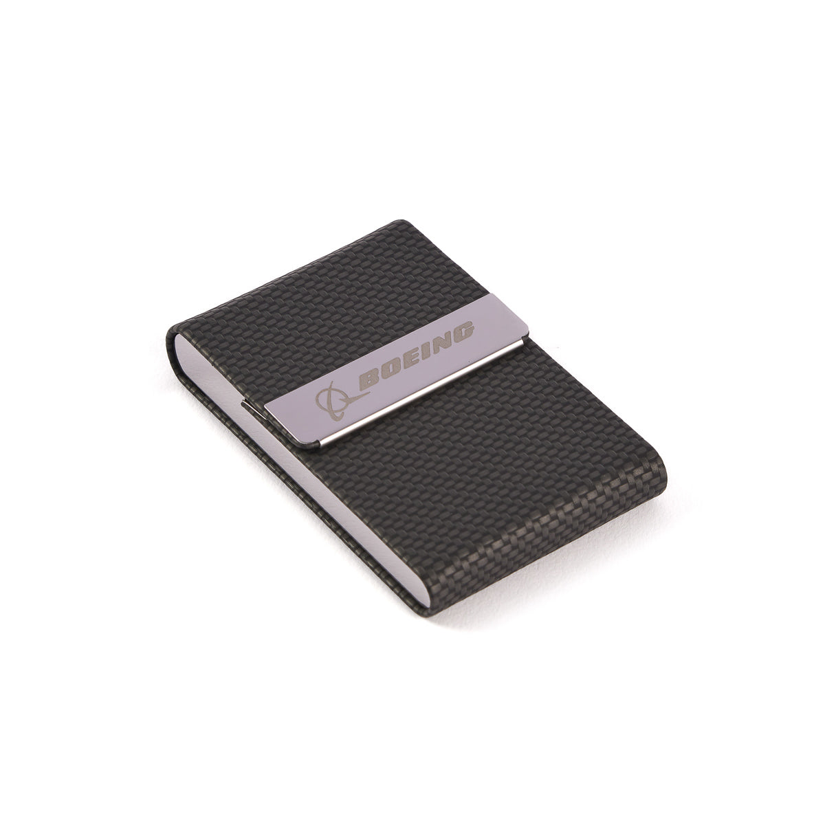 The Boeing Carbon Fiber Card Holder by The Boeing Store features a sleek black textured design with a metallic clip embossed with the Boeing logo. It includes a magnetic closure and is showcased elegantly against a white background.