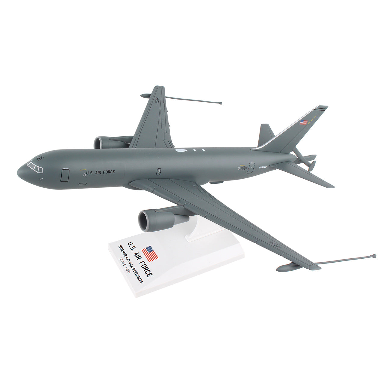 The Daron Boeing KC-46A USAF 1:200 Model features a sleek gray aircraft with American flag insignias on the wings and fuselage. Ideal for collectors, it includes a white stand labeled U.S. Air Force with a small American flag.