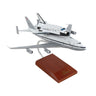 The Daron Boeing B-747 With Shuttle 1:200 Endeavour Model features the Endeavour shuttle atop a detailed 747, displayed on a wooden stand—an ideal collectible for aviation and space enthusiasts.