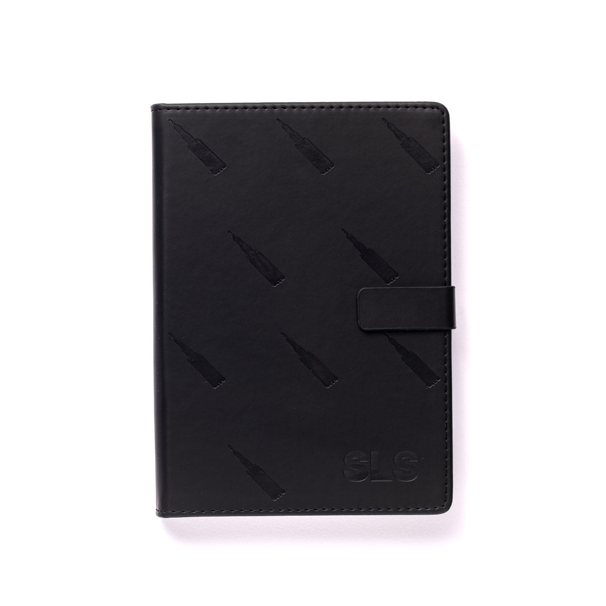 The elegant Boeing SLS Notebook by The Boeing Store boasts a sleek black leather cover adorned with vertical bottle-like patterns, an embossed SLS in the bottom right corner, and a convenient strap closure. Ready for your thoughts to soar, it is presented on a white background.